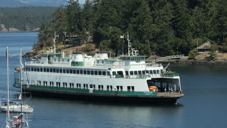 Vehicle-Ferry-sailing-through-Harbor-near-Pine-Trees