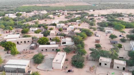 Aerial-Ascending-Shot-With-Tilt-Down-View-Of-Rural-Village-In-Sindh,-Pakistan