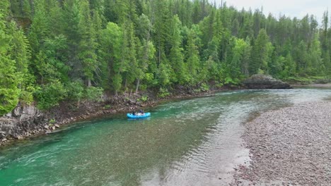 Raft-Boat-On-Flathead-River-With-Dense-Trees-Near-Glacier-National-Park-In-Montana,-USA
