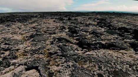 Shaky-flying-above-mossy-lava-field-landscape