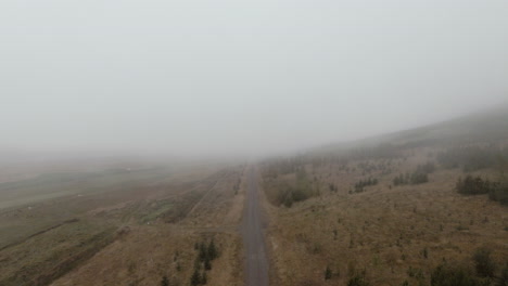 Footage-above-gravel-road-in-foggy-icelandic-countryside