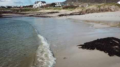 Cllifden-sandy-beach-in-Connemara,-aerial-view,-waves-crashing-on-the-shore