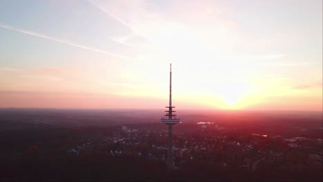 Aerial-Drone-shot-of-Kiel-Transmission-Tv-Tower-with-a-reddish-evening-sky