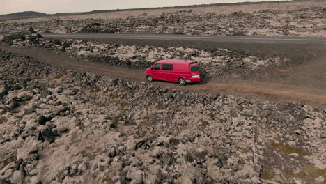 Red-van-in-middle-of-lava-fields