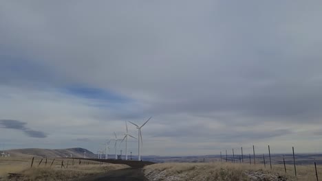 Driving-past-wind-farm-on-a-cloudy-day
