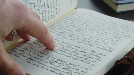 Flipping-through-handwritten-notebook-or-journal-to-a-blank-page