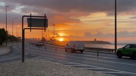 car-traffic-and-sunset-near-of-beach-and-castle