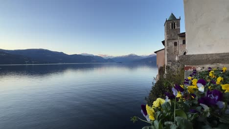 Colorful-flowers-at-hermitage-of-Santa-Caterina-Del-Sasso-in-Italy-overlooking-Lake-Maggiore