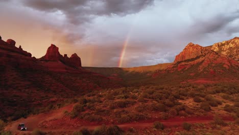 Dramatic-Sunset-Sky-With-Clouds-And-Rainbow-Over-Red-Rocks-Landscape-In-Sedona,-Arizona,-USA