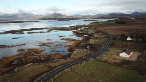 aerial-view-of-a-road-in-the-irish-countryside,-Connemara,-on-the-atlantic-shore