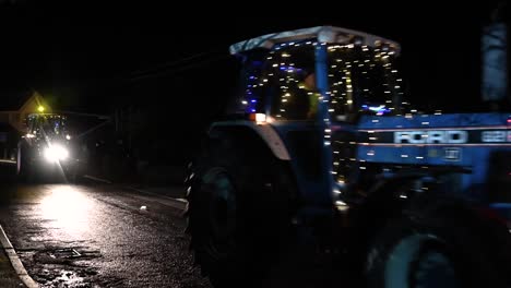 Flashing-your-lights-to-the-Christmas-Tractors,-Festive-Hope-Tractor-Run,-Horseman's-Green,-Whitchurch,-United-Kingdom