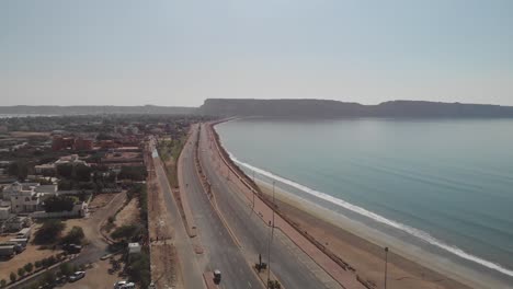 Aerial-View-Of-Marine-Drive-Beside-Beach-Coastline-In-Gwadar-With-Traffic-Going-Past