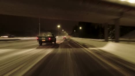 POV-shot-traveling-quickly-along-a-snowy-highway-in-Helsinki