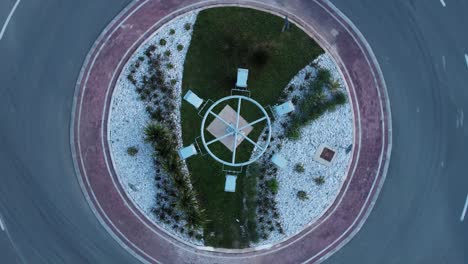 Roundabout-road-with-cars.-Drone-footage-over-day