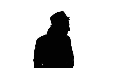 Man-in-long-coat-puts-on-hat,-black-silhouette-on-white-background