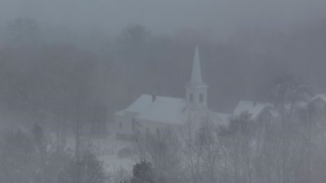 Monson-community-church-seen-through-heavy-snowfall-low-visibility