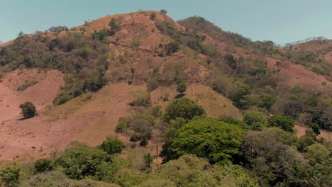 Aerial-crane-shot-of-Costa-Rican-mountain-hiking-trail-in-rural-wilderness