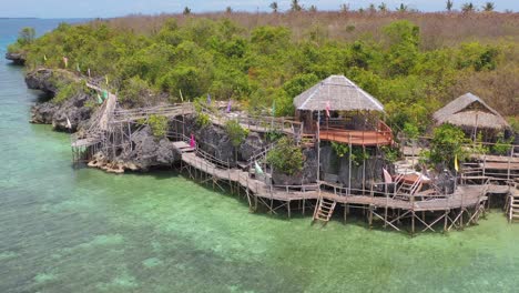 Aerial-pullout-over-shelters-and-walkway-built-over-water-in-Philippines