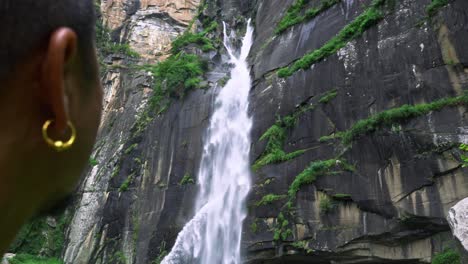 Man-looking-up-to-jogini-waterfall-for-inspiration-