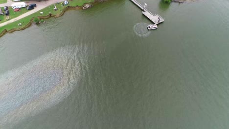 Aerial-view-of-boat-leaking-gas-into-Lake-Tawakoni
