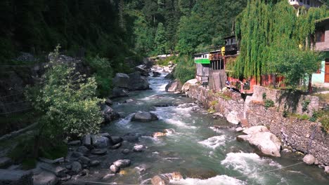 A-sliding-shot-from-old-manali-bridge-of-manalsu-river-flowing-down-the-valley