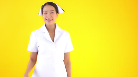 A-young-attractive-Asian-woman-in-traditional-nurses-uniform-pantomimes-a-knock-and-wave