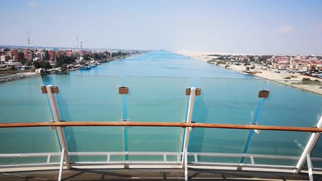 Panoramic-View-from-Cruise-Ship-Passing-Famous-Suez-Canal-during-Day