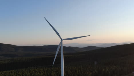 Giant-windmill-generating-clean-energy-in-mountain-terrain