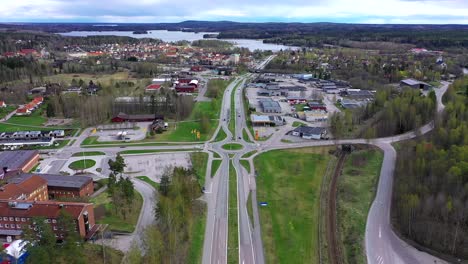 Reversed-dolly-over-traffic-intersection-with-roads-and-a-roundabout