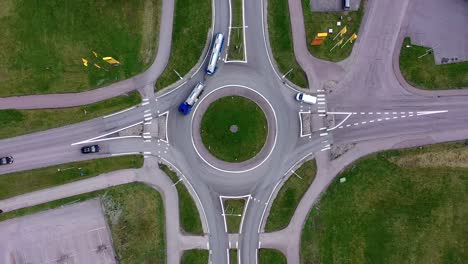 Top-down-view-over-traffic-intersection-with-roads-and-a-roundabout