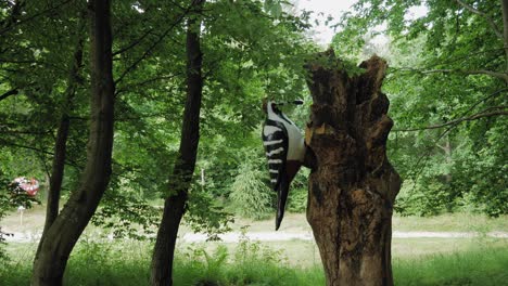 Large-Woodpecker-Model-in-Kashubian-Park-of-Giants-In-Strysza-Buda,-Poland