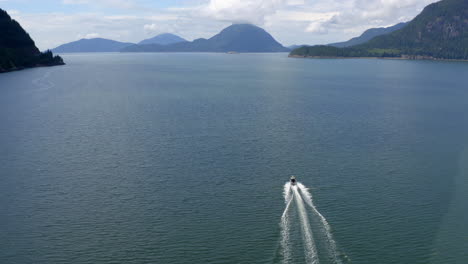Aerial-shot-of-motorboat-on-Howe-Sound-near-Porteau-Cove-on-beautiful-summer-day