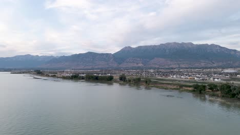 Utah-Lake-Shoreline-with-City-of-Orem,-Vineyard,-and-Provo-in-Background---Aerial-Drone-Landscape