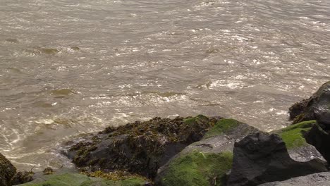 Close-up-of-the-Irish-sea-crashing-up-against-rocks