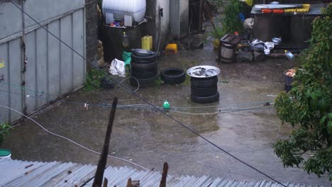 During-Heavy-rain,-the-family-left-everything-in-the-courtyard-and-go-back-inside,-everything-is-abandoned-even-washing-the-clothes