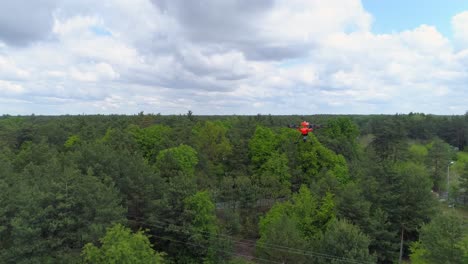 A-Flying-Yuneec-H520-Drone-Over-The-Green-Trees---aerial-drone