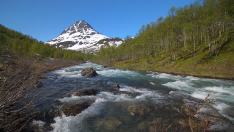 Static-view-of-rapids-high-up-in-the-Lyngen-alps,-sunny,-summer-day,-in-North-Norway