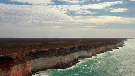 Aerial-View-showing-beautiful-cliff-landscape-beside-ocean-shore-in-Australia