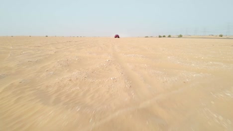 Truck-racing-towards-camera-in-the-desert