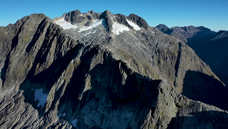 drone-shot-Milford-Sound-Gertrude-Saddle-Fiordland-National-Park,-New-Zealand-mountains