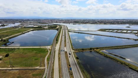 Aerial-view-of-a-Highway-road-surrounded-water