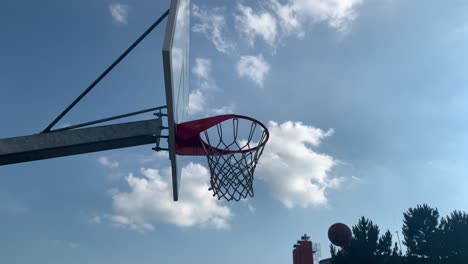 Orange-basketball-flies-to-the-basket-with-net