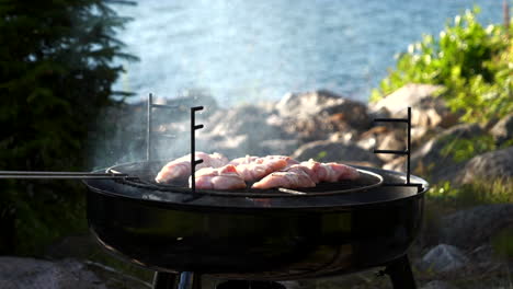 Smoking-fillets-on-outdoor-coal-grill,-slow-motion