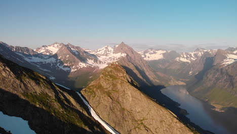 Aerial-view-of-mountain-tops-at-Norway-Sunnmøre-flying-sideways-around