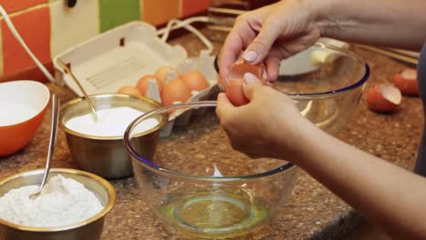 Separating-egg-whites-from-yolks-for-cake-mix-batter