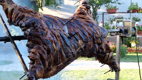 4K-Detail-View-of-Appetizing-Whole-Lamb-Carcass-Rotating-on-a-Spit