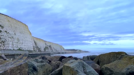 Smooth-right-tracking-view-over-the-rocks-along-the-White-Cliffs-of-Dover-under-a-blue-morning-sky