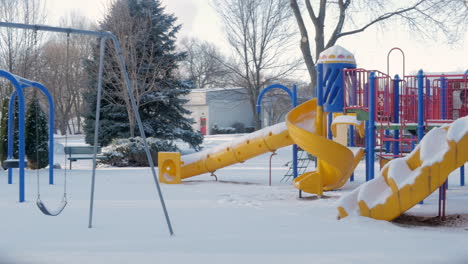 Empty-snow-covered-playground-in-the-middle-of-winter