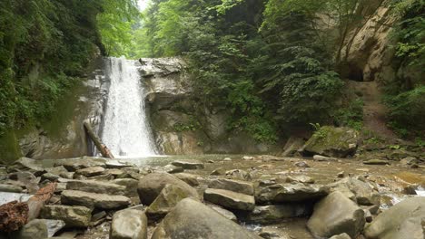 Wide-Shot-of-Small-But-Spectacular-Pruncea-Waterfall-Surrounded-by-Greenery-and-Rocks