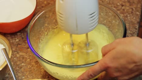 Beating-egg-cake-batter-mixture-with-hand-mixer